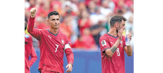 Ronaldo double fires Portugal, Ghana thwart England